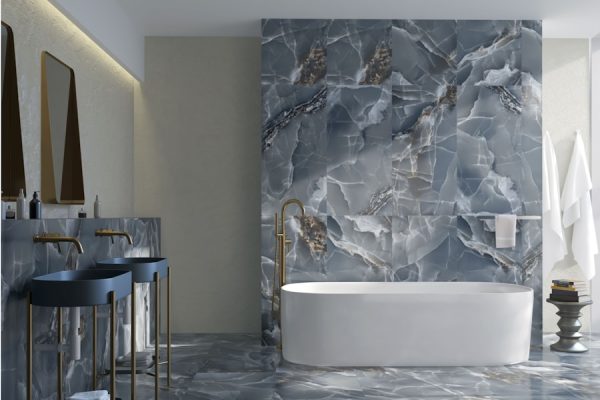 a bathroom with a marble wall and floor